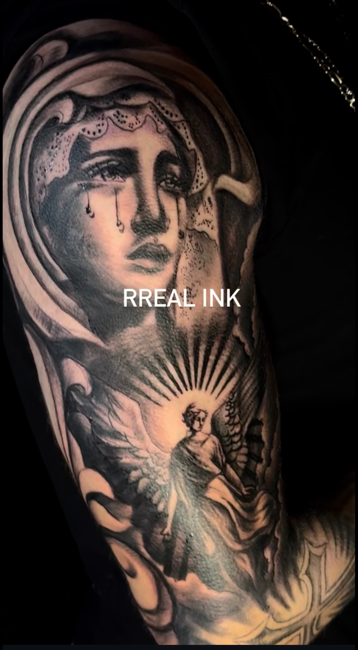 Crying Virgin Mary and angel black and gray half sleeve tattoo