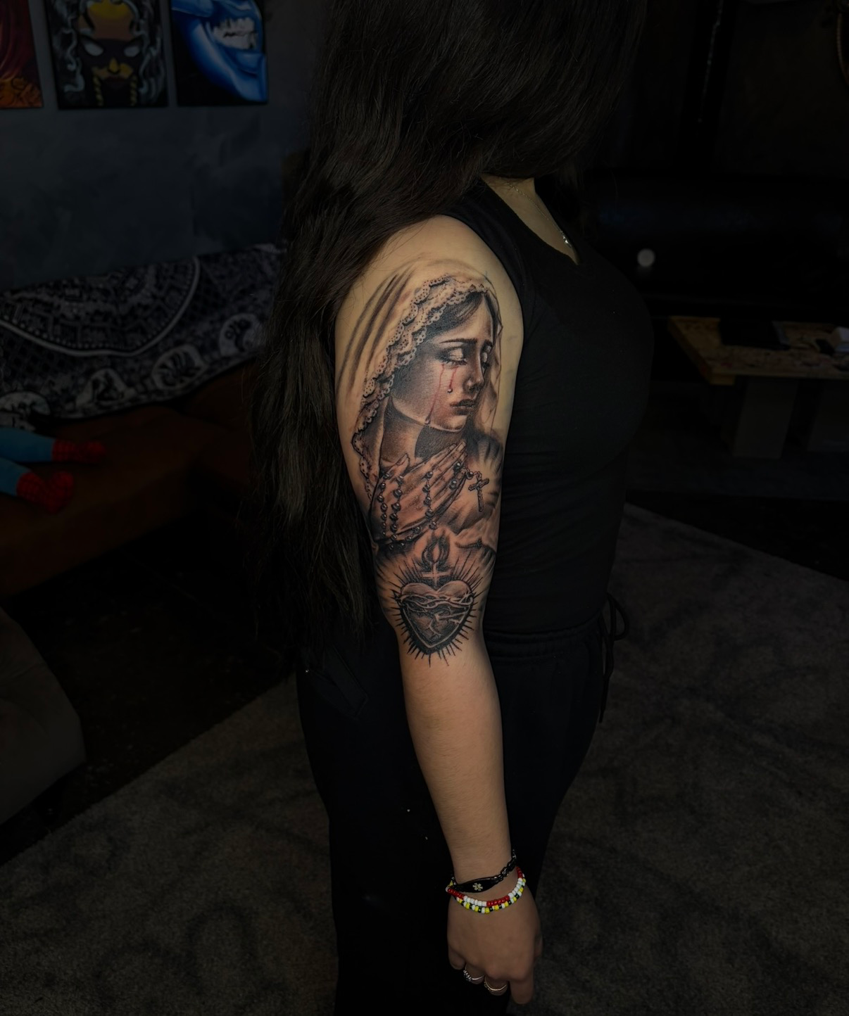 Crying Virgin Mary with sacred heart upper arm tattoo