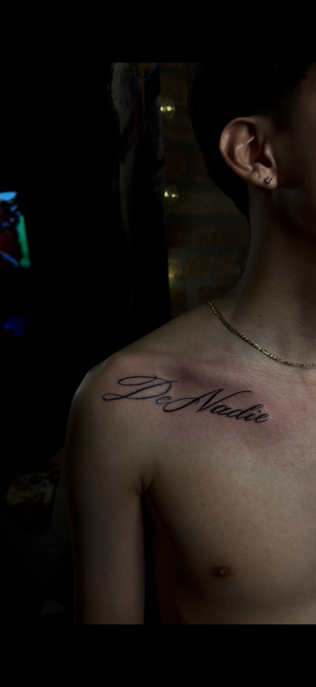 De nadie script lettering collarbone tattoo